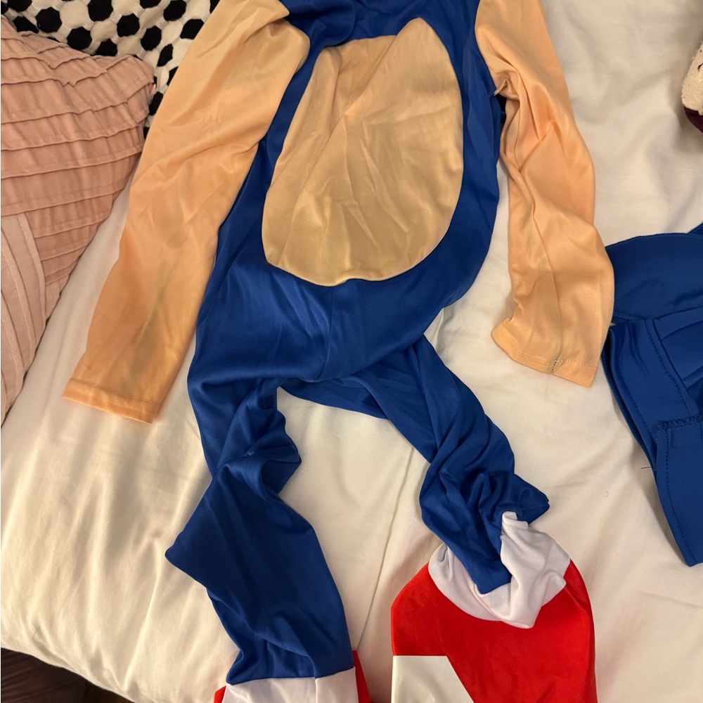 Blue and Beige Costume with Red and White Shoes